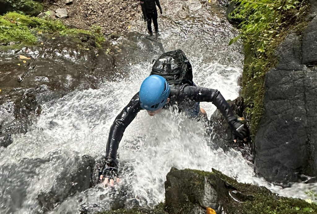 Author climbing a small waterfall in the Okutama region